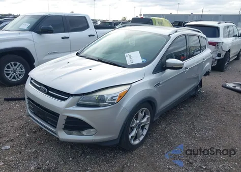 2014 Ford Escape Titanium z USA, uszkodzony, nr VIN 1FMCU0J91EUB45509